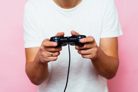 Man playing on the joystick in a game console