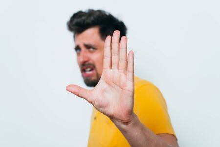 Businessman shows stop gesture