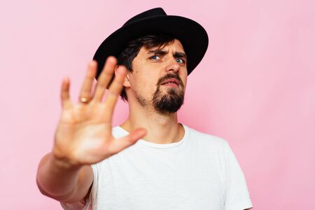 Businessman shows stop gesture