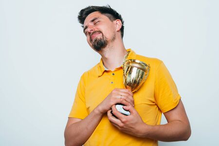 man with a golden cupの写真素材