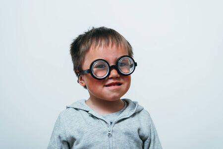 Little boy in funny glassesの写真素材