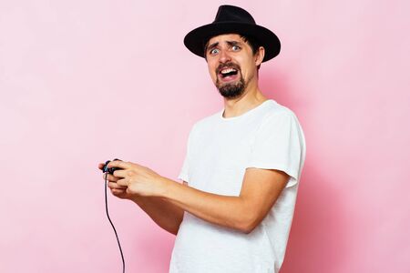 Man playing on the joystick in a game consoleの写真素材