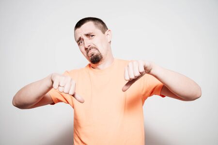 man showing a thumb down gesture