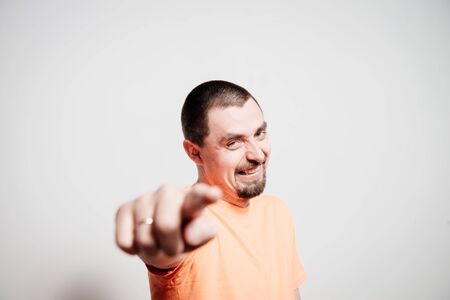 Young man showing his index finger towards the camera
