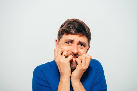 man bites his nailsの写真素材