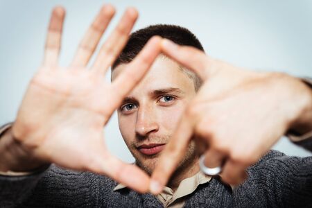 man making frame handの写真素材