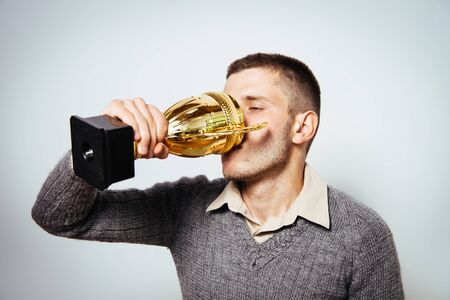 man with a golden cupの写真素材