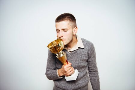 man with a golden cupの写真素材