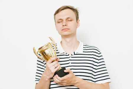 man with a golden cupの写真素材