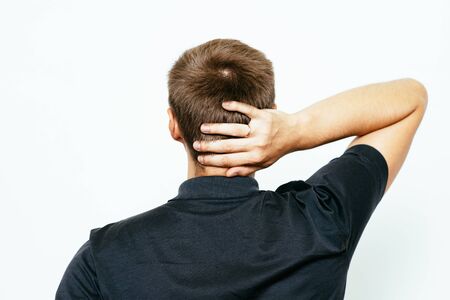 holding his head. The back man