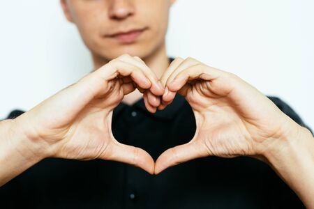 man making a hand heart frameの写真素材
