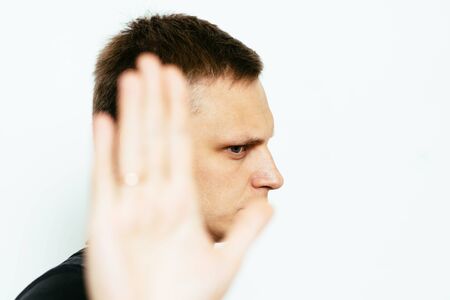 Businessman shows stop gesture