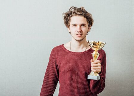 Happy man with a golden cup