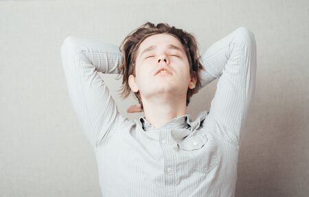 man leaned back in his chairの写真素材