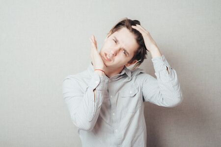 Businessman with neck pain after long hours at workの写真素材