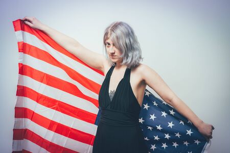 Woman listening national anthem. Patriot.の写真素材