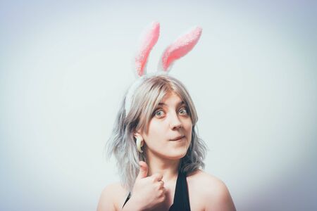 Portrait of girl with white rabbit earsの写真素材