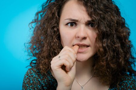 Woman bites his nails