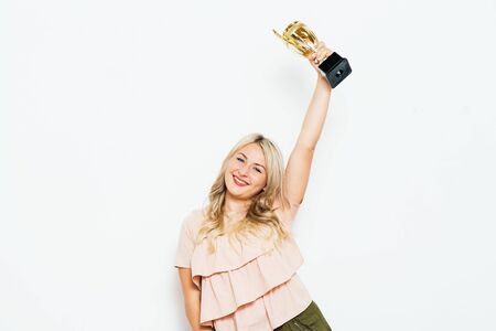 Woman with a golden cupの写真素材