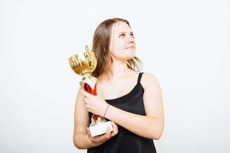 Woman with a golden cupの写真素材