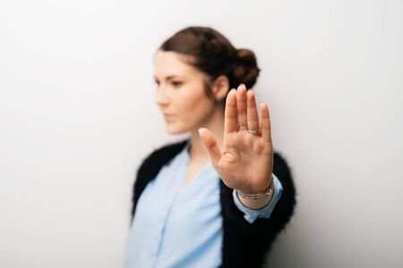 The woman gestured stop timeout. Isolated on a white background