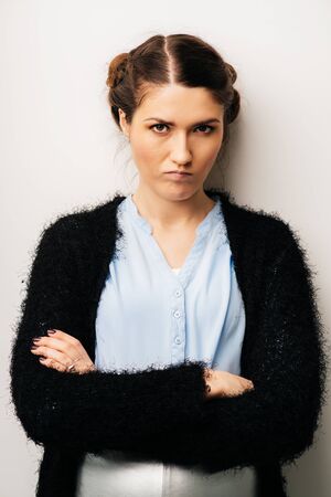 Woman thinks dissatisfied, angry, resentful. Isolated on a white background