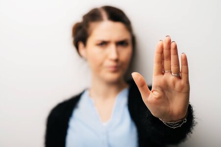The woman gestured stop timeout. Isolated on a white background