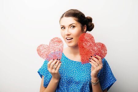girl holding a paper heart