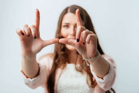 girl doing hand frameの写真素材