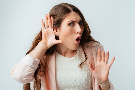 long-haired beautiful brunette girl overhearsの写真素材