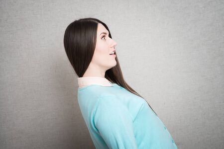 woman in shock profile. isolated on gray backgroundの写真素材