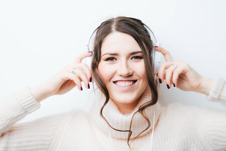 on a white background girl with headphonesの写真素材