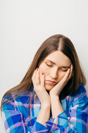Sleepy or drowsy young womanの写真素材