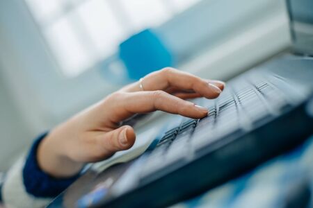 Young manager working with notebook in the office