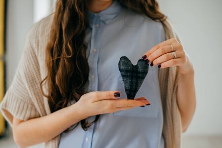 hands holding a soft heart shape