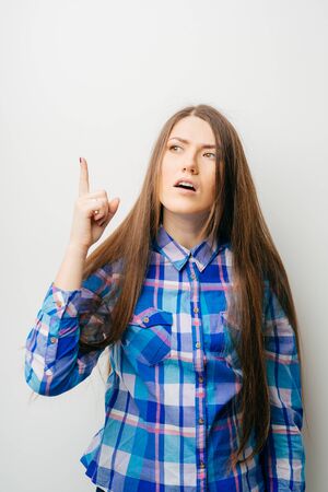 young girl shows a sign of attentionの写真素材