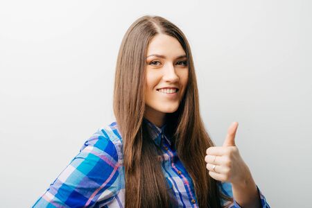 Success woman showing thumbs upの写真素材