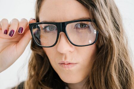 beautiful brunette girl with big glassesの写真素材