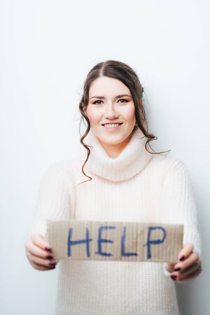 teenage girl in casual clothes holding  sheet of paper