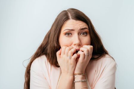 long-haired beautiful young brunette woman fears