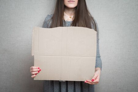 young woman showing empty boardの写真素材