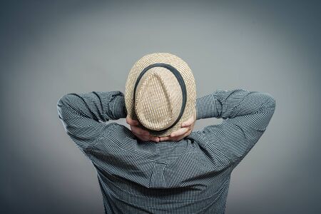 Male tourist with hat , rear view, backの写真素材