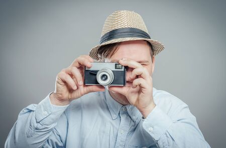 portrait of stylish handsome man with cameraの写真素材