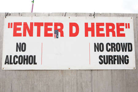 A festival entry sign warning about alcohol and crowd surfingの写真素材