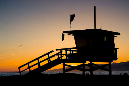 Sunset thru a lifeguard tower near Santa Monica in Los Angeles, USAの写真素材