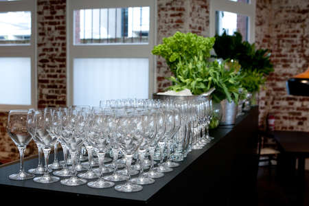 Rows of glasses ready for a party functionの写真素材