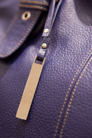 A closeup of a leather bag and charmの写真素材