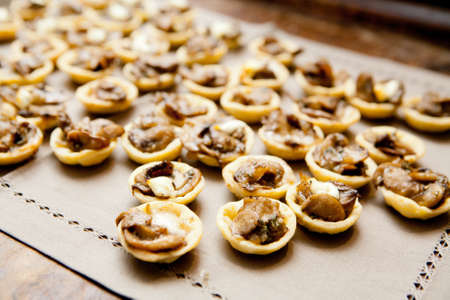 A mushroom based canape is served at a cocktail partyの写真素材