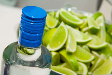 A bucket of limes for cocktails at a partyの写真素材