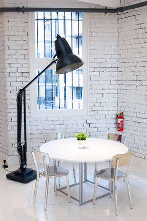 A modern table, chair and lamp の写真素材